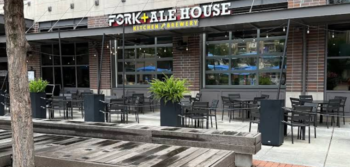The open-air patio and garage-door windows at Fork + Ale House in Midtown Carmel